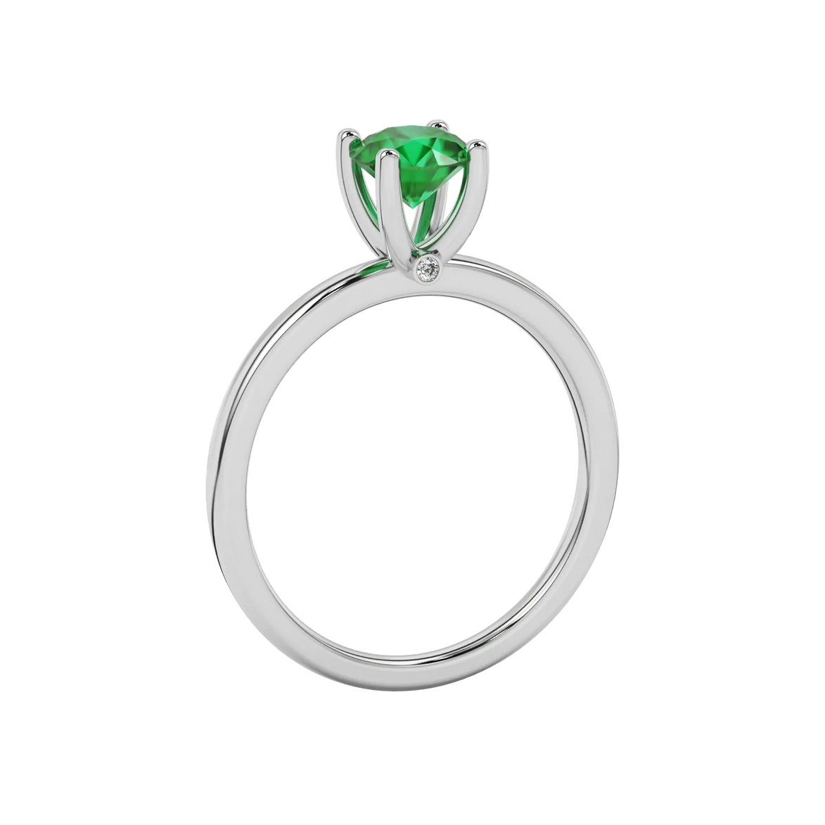 Side view of a white gold emerald green gemstone ring featuring a clean surprise diamond gallery.