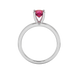 Round-cut raspberry red gemstone solitaire ring in a white gold surprise diamond setting.