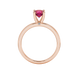 Round-cut raspberry red gemstone solitaire ring in a rose gold surprise diamond setting