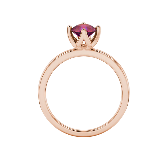 Round-cut raspberry red gemstone solitaire ring in a rose gold tulip basket setting