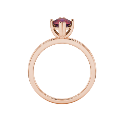 Round-cut raspberry red gemstone solitaire ring in a rose gold vintage basket setting.