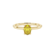 Close-up, oval cut canary yellow gemstone, yellow gold six prong ring.