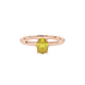 Close-up, oval cut canary yellow gemstone ring, rose gold six prong setting.