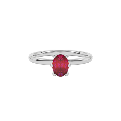 Close-up oval cut raspberry red gemstone ring, white gold six prong setting.