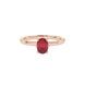 Close-up, oval cut raspberry red gemstone ring, rose gold six prong setting.