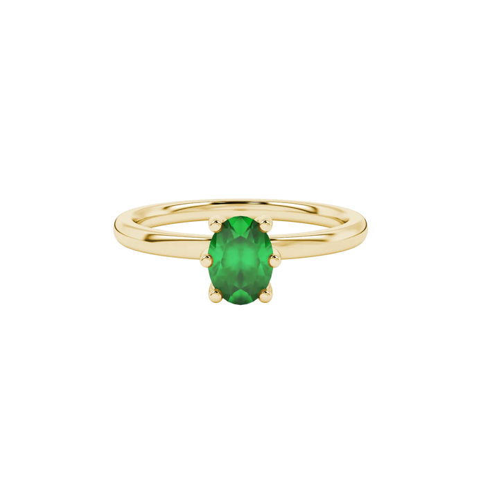 Close-up, oval cut emerald green gemstone, yellow gold six prong ring.