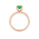 Oval cut emerald green gemstone ring, rose gold six prong setting.