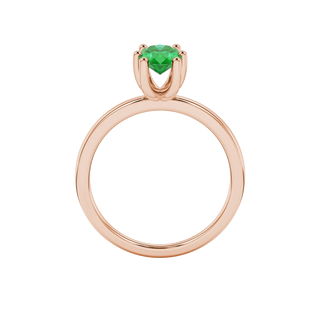 Oval cut emerald green gemstone ring, rose gold six prong setting.
