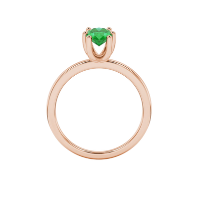 Oval cut emerald green gemstone ring, rose gold six prong setting.