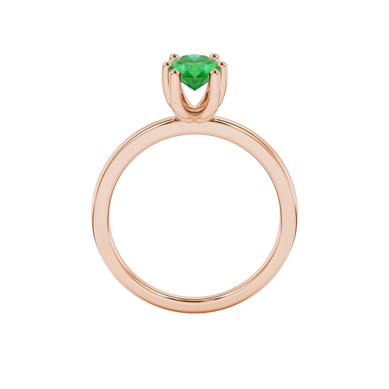 Oval cut emerald green gemstone ring, rose gold six prong setting.