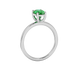 Side profile, white gold emerald green ring, classic basket gallery.