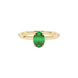 Close-up, oval cut emerald green gemstone, yellow gold classic basket ring.