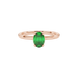 Close-up, oval cut emerald green gemstone ring, rose gold classic basket.