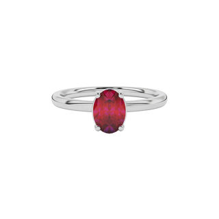 Close-up oval cut raspberry red gemstone ring, white gold classic basket.