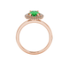 Oval cut emerald green gemstone ring, rose gold falling edge halo setting.