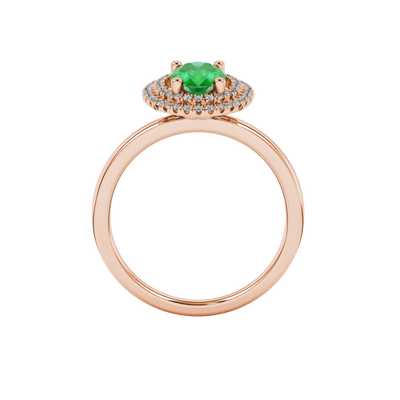 Oval cut emerald green gemstone ring, rose gold falling edge halo setting.