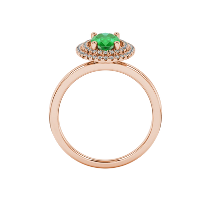 Oval cut emerald green gemstone ring, rose gold falling edge halo setting.