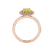 Oval cut canary yellow gemstone ring, rose gold falling edge halo setting.