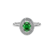 Close-up emerald green gemstone ring, white gold falling edge halo.