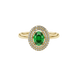 Close-up, oval cut emerald green gemstone, yellow gold falling edge halo ring.