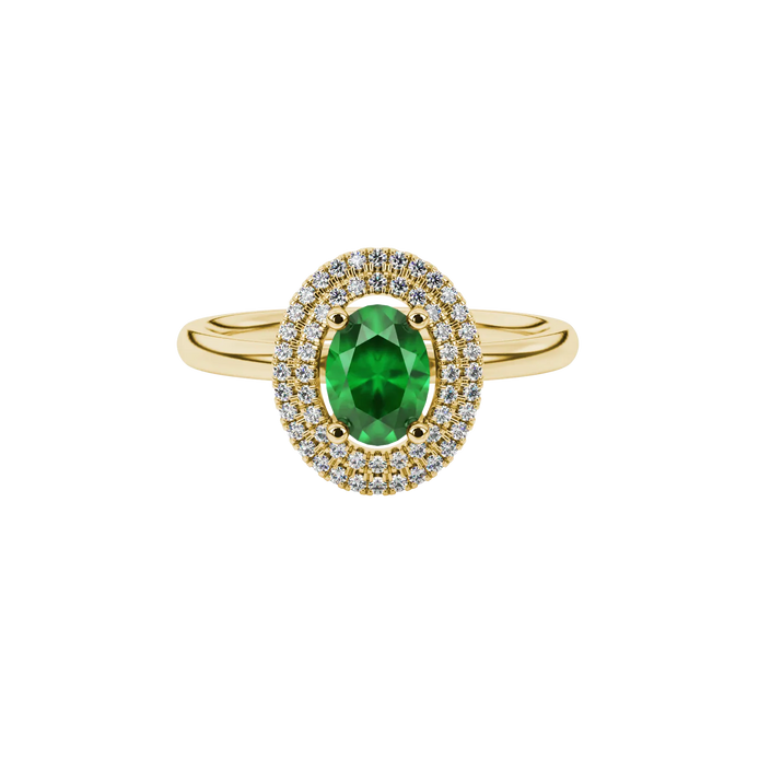 Close-up, oval cut emerald green gemstone, yellow gold falling edge halo ring.