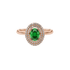 Close-up, oval cut emerald green gemstone ring, rose gold double halo.