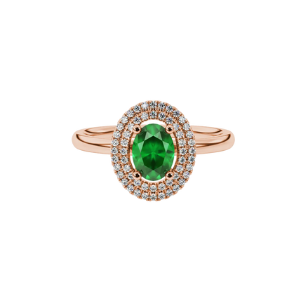 Close-up, oval cut emerald green gemstone ring, rose gold double halo.