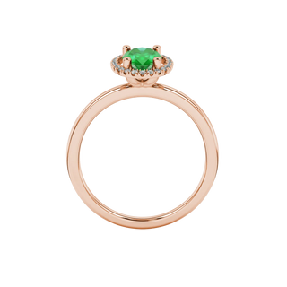 Oval cut emerald green gemstone ring, rose gold french pavé halo setting.