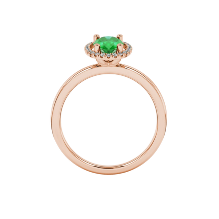 Oval cut emerald green gemstone ring, rose gold french pavé halo setting.