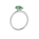 Side profile, white gold emerald green ring, french pavé halo gallery.