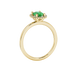 Side profile, yellow gold emerald green ring, french pavé halo gallery.