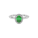 Close-up emerald green gemstone ring, white gold french pavé halo