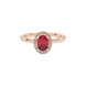 Close-up, oval cut raspberry red gemstone ring, rose gold french pavé halo