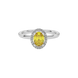 Close-up canary yellow gemstone ring, white gold french pavé halo. 