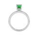 Oval cut emerald green gemstone ring, white gold lotus basket setting.