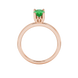 Oval cut emerald green gemstone ring, rose gold lotus basket setting.