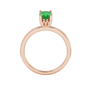 Oval cut emerald green gemstone ring, rose gold lotus basket setting.