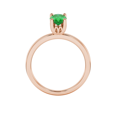 Oval cut emerald green gemstone ring, rose gold lotus basket setting.
