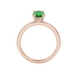 Oval cut emerald green gemstone ring, rose gold pavé basket setting.