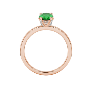 Oval cut emerald green gemstone ring, rose gold pavé basket setting.