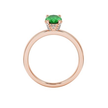 Oval cut emerald green gemstone ring, rose gold pavé basket setting.