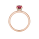 Oval cut raspberry red gemstone ring, rose gold pavé basket setting.