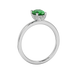 Side profile, white gold emerald green ring, pavé basket gallery.