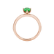 Oval cut emerald green gemstone ring, rose gold scalloped six prong setting.