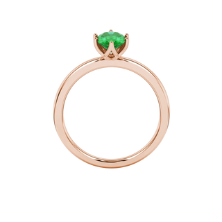Oval cut emerald green gemstone ring, rose gold scalloped six prong setting.