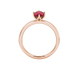 Oval cut raspberry red gemstone ring, rose gold scalloped six prong setting.