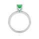 Oval cut emerald green gemstone ring, white gold surprise diamond setting.