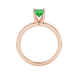 Oval cut emerald green gemstone ring, rose gold surprise diamond setting.