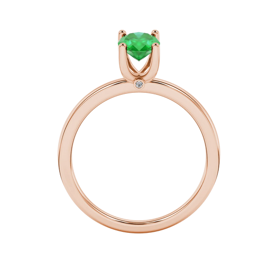 Oval cut emerald green gemstone ring, rose gold surprise diamond setting.