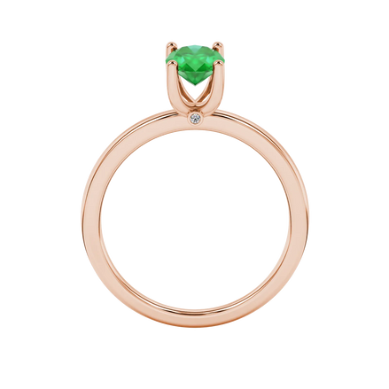 Oval cut emerald green gemstone ring, rose gold surprise diamond setting.